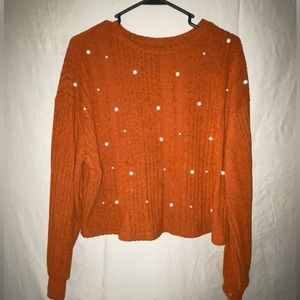 Burnt Orange Top with beads. Good condition.